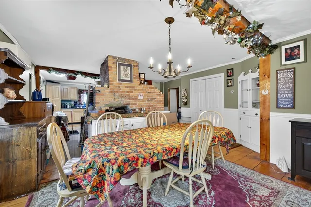 a kitchen with stainless steel appliances granite countertop a refrigerator a stove a sink and a refrigerator