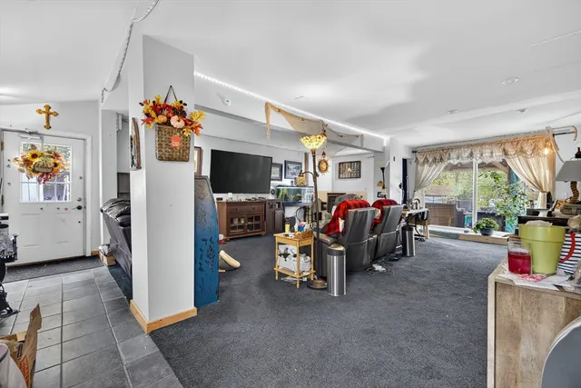 a view of an entryway with wooden floor