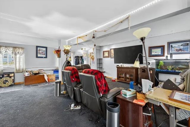 a view of walk in closet with clothes