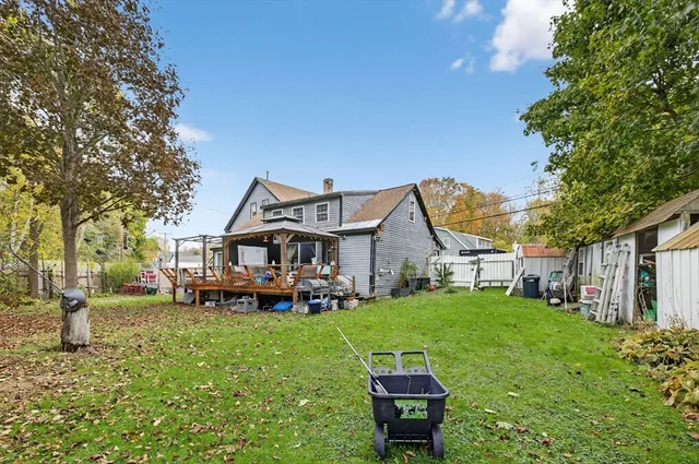 a view of a house with a yard porch and sitting area