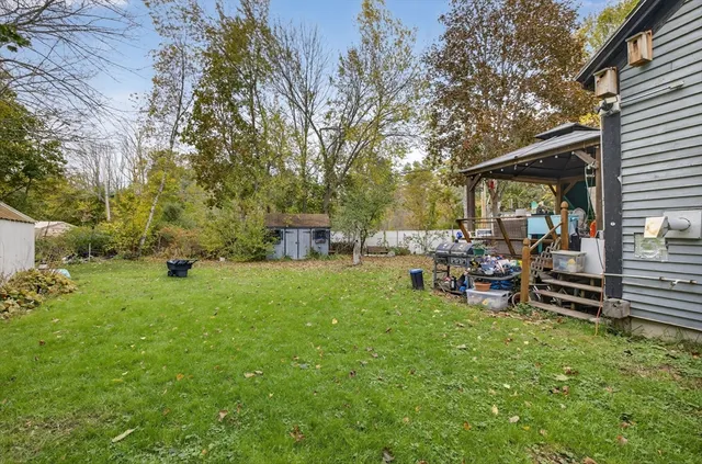 a view of a backyard with sitting area