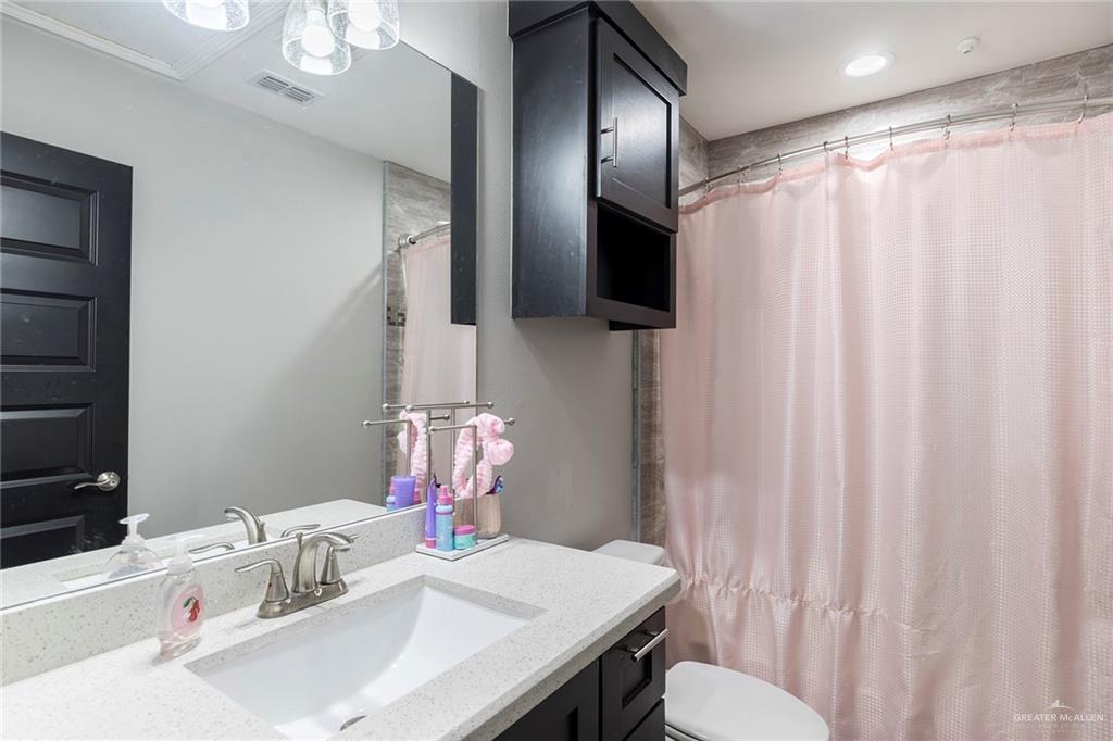 503 Northern Dancer Avenue Edinburg, TX 78539 - Photo 13 of 34 a bathroom with a sink toilet and shower