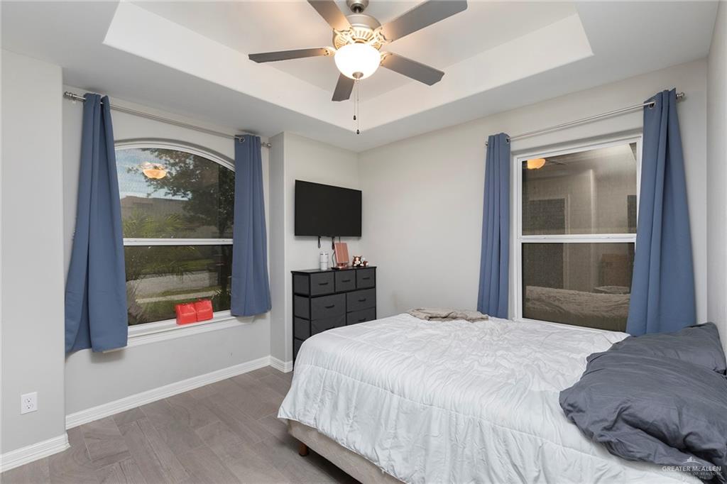 503 Northern Dancer Avenue Edinburg, TX 78539 - Photo 14 of 34 a bedroom with a bed and a flat tv screen on the dresser