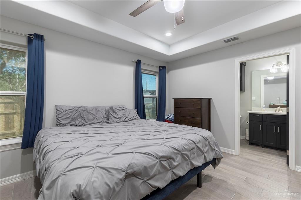 503 Northern Dancer Avenue Edinburg, TX 78539 - Photo 15 of 34 a bedroom with a large bed and a large window