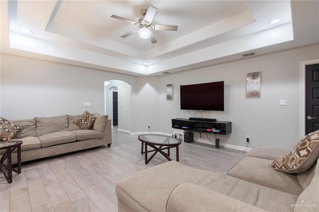 503 Northern Dancer Avenue Edinburg, TX 78539 - Photo 21 of 34 a living room with furniture and a flat screen tv