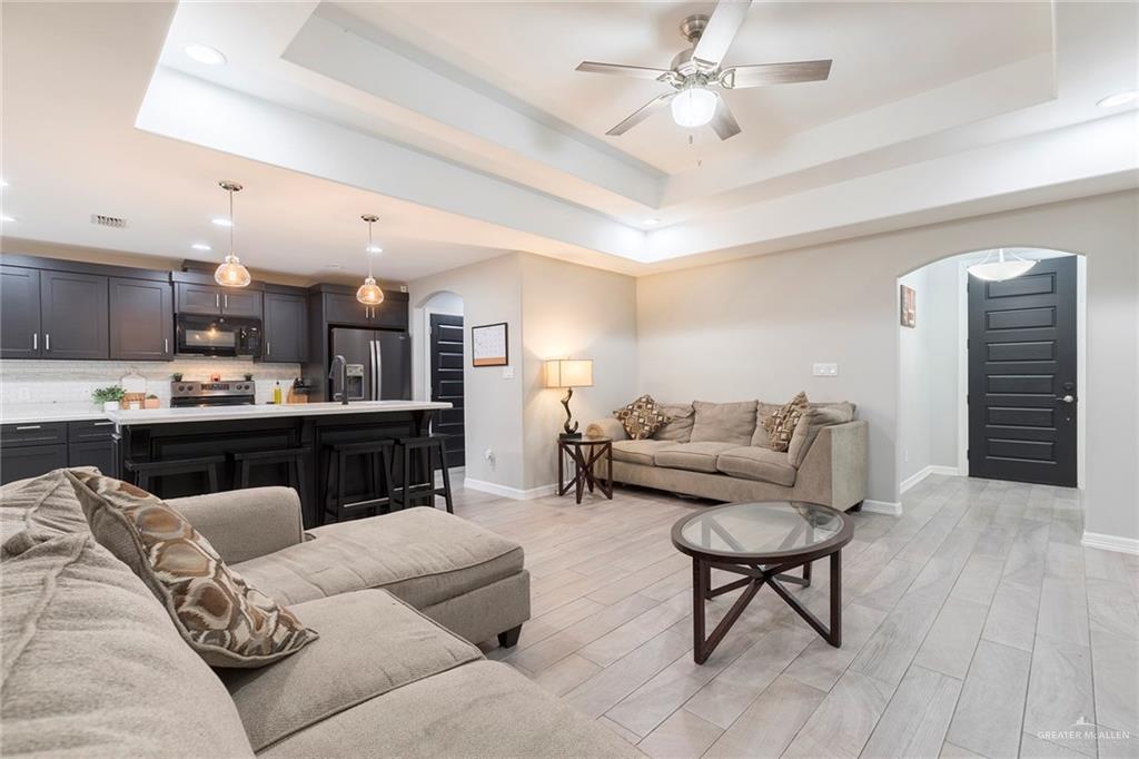 503 Northern Dancer Avenue Edinburg, TX 78539 - Photo 22 of 34 a living room with furniture and kitchen view