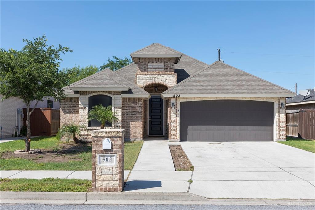 503 Northern Dancer Avenue Edinburg, TX 78539 - Photo 23 of 34 a front view of a house with garden