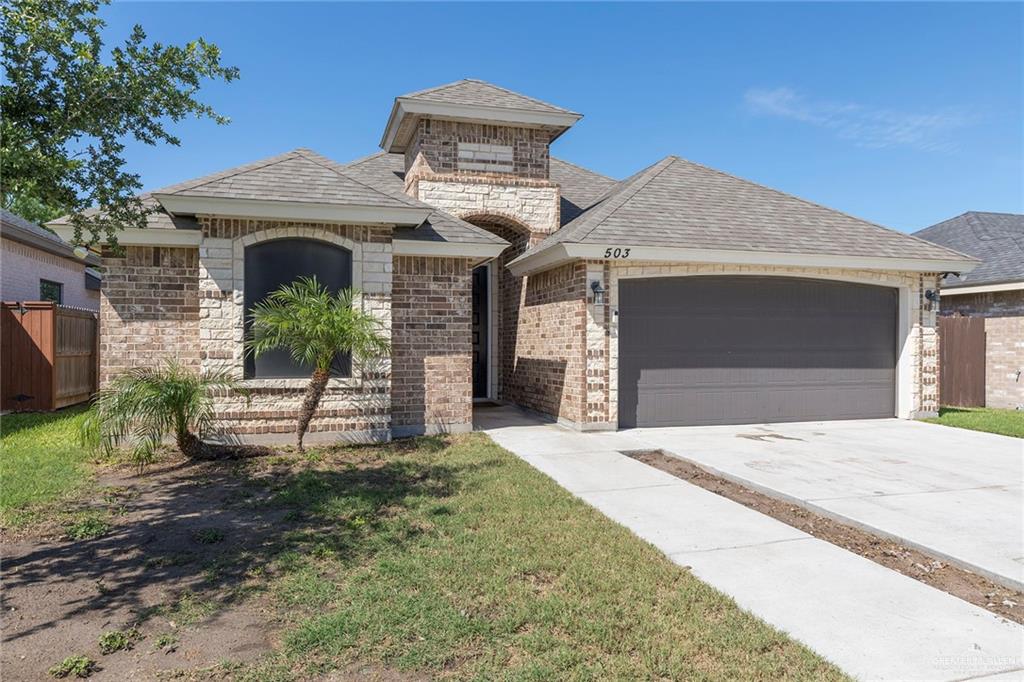 503 Northern Dancer Avenue Edinburg, TX 78539 - Photo 33 of 34 a front view of a house with a garden and plants