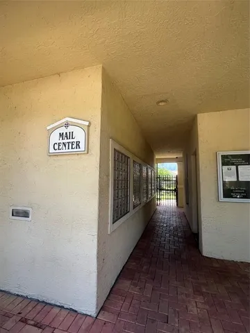 a swimming pool with outdoor seating and yard