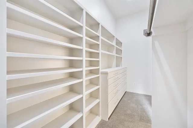 a view of an empty walk in closet