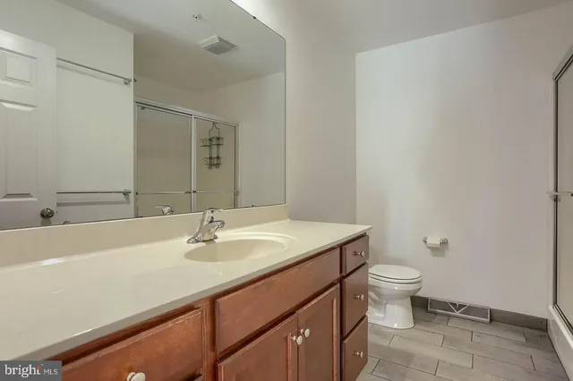 a bathroom with a sink toilet and vanity