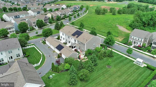 an aerial view of a house with outdoor space pool seating area and yard