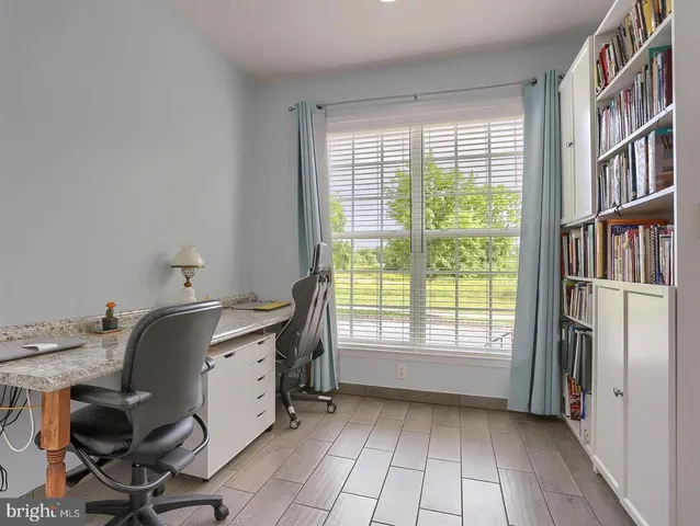 a workspace with furniture and a window