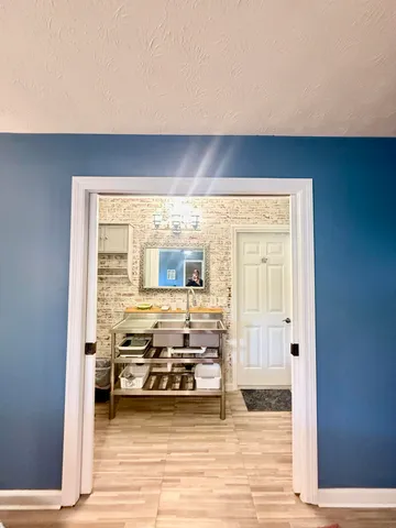 a bathroom with a glass shower door
