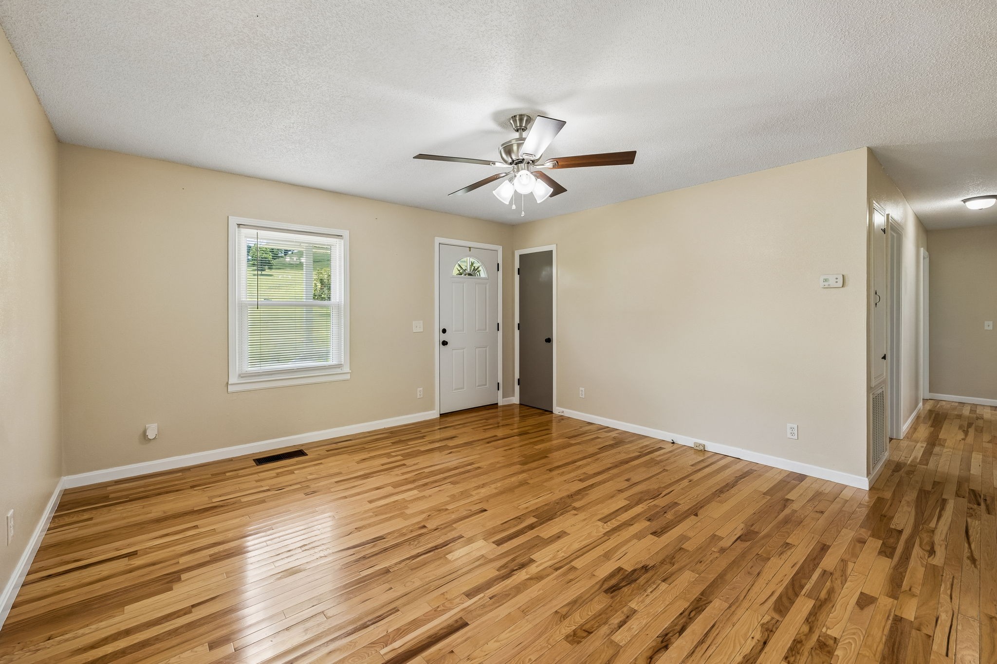 14 Morris Lane Carthage, TN 37030 - Photo 13 of 31 a view of empty room with wooden floor and fan
