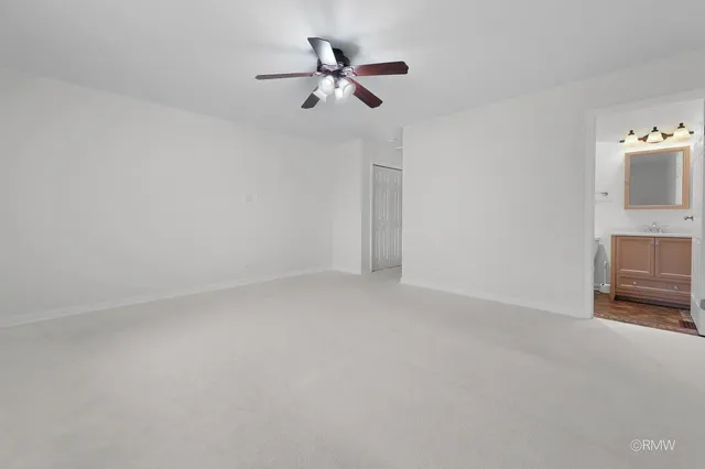 a view of room with ceiling fan and ceiling fan
