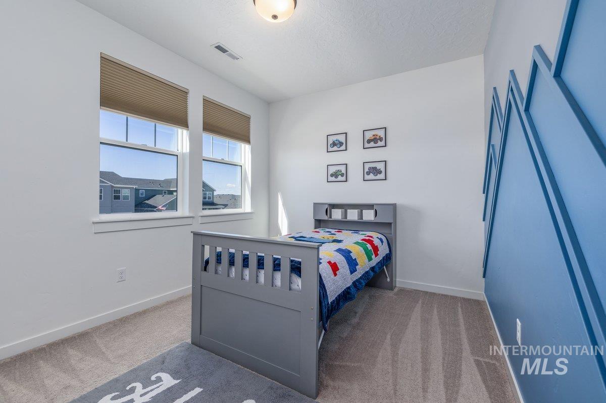 1380 West Chilitna Street Meridian, ID 83642 - Photo 35 of 50 Bright room featuring two large windows with horizontal blinds
