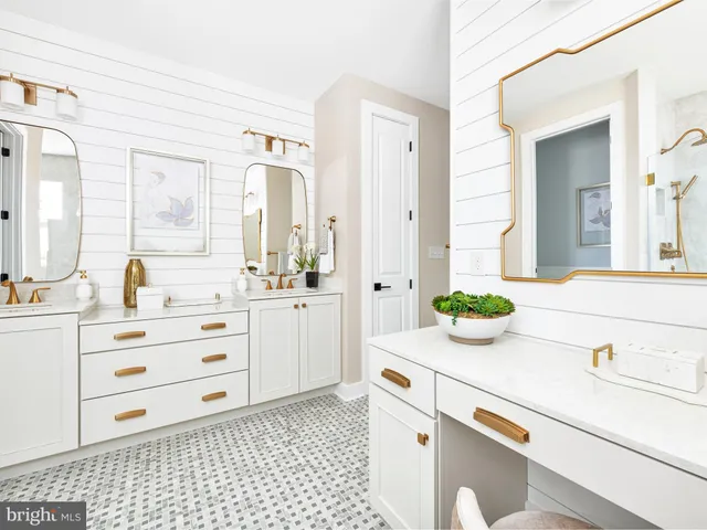 a bathroom with a sink a vanity and a mirror