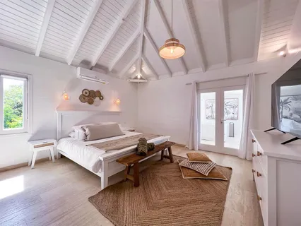 a bedroom with furniture and a window