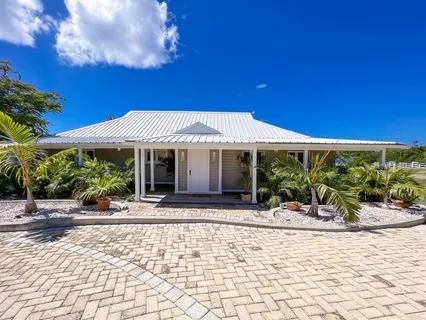 a front view of a building with garden