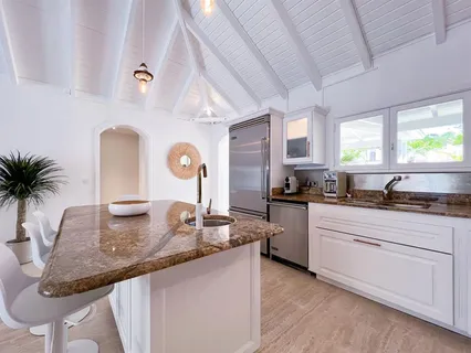 a kitchen with granite countertop a stove a sink and a granite counter tops