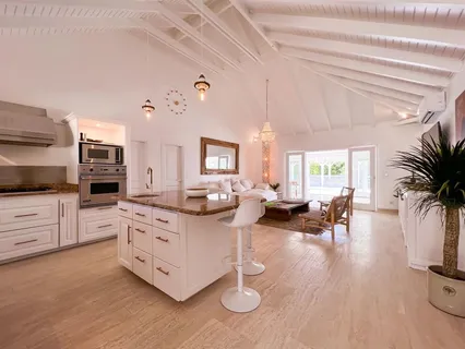 a living room with furniture and flat screen tv