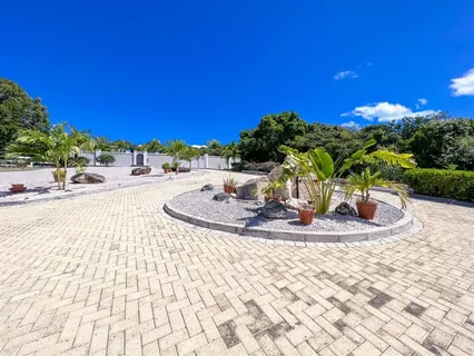 a view of a swimming pool with a yard