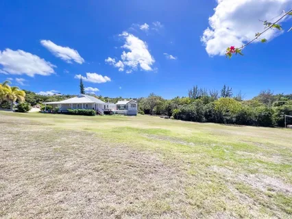 a view of a lake with a building in the background