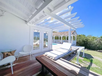 a view of a patio with wooden flooring