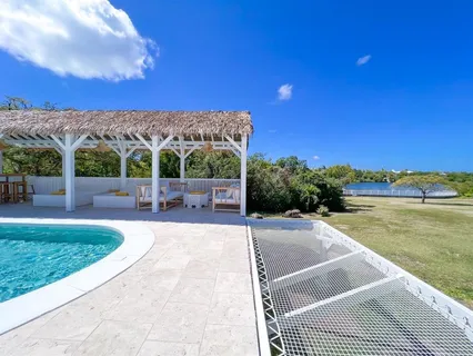 a view of a swimming pool with a patio
