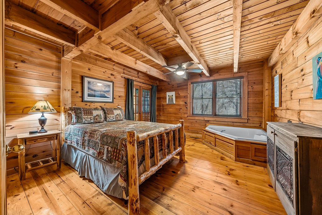2136 Hines Gap Road Warm Springs, GA 31830 - Photo 20 of 63 a spacious bedroom with a bed and wooden floors