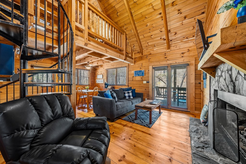 2136 Hines Gap Road Warm Springs, GA 31830 - Photo 30 of 63 a living room with furniture a couch and a fireplace
