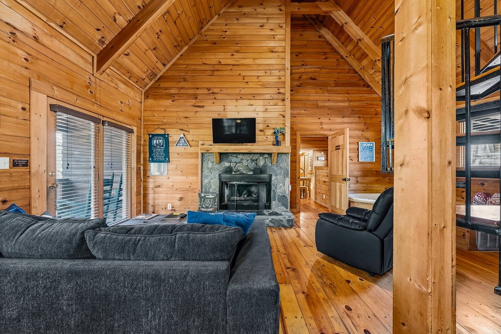 2136 Hines Gap Road Warm Springs, GA 31830 - Photo 31 of 63 a living room with furniture fireplace and flat screen tv
