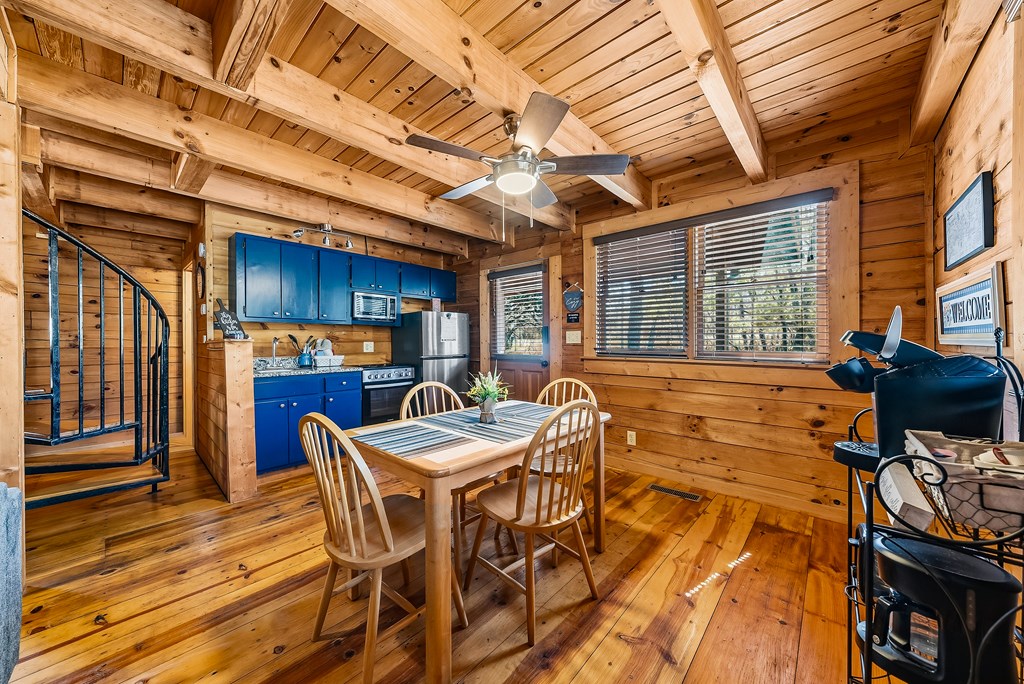 2136 Hines Gap Road Warm Springs, GA 31830 - Photo 35 of 63 a view of a dining room with furniture window and wooden floor