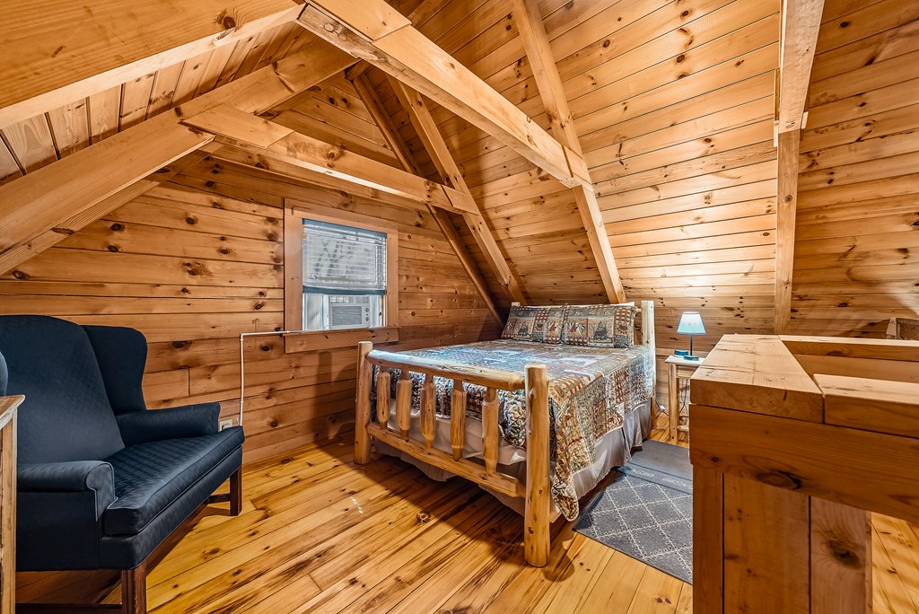 2136 Hines Gap Road Warm Springs, GA 31830 - Photo 39 of 63 a view of a balcony with furniture and wooden floor