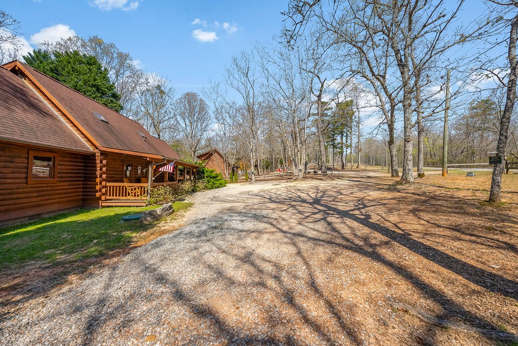 2136 Hines Gap Road Warm Springs, GA 31830 - Photo 4 of 63 a front view of a house with a yard and garage