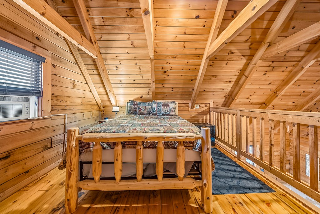 2136 Hines Gap Road Warm Springs, GA 31830 - Photo 53 of 63 a view of a balcony with wooden floor and iron stairs