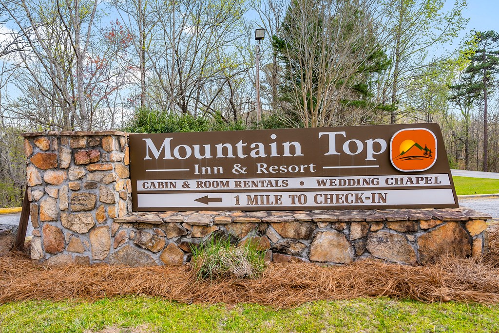 2136 Hines Gap Road Warm Springs, GA 31830 - Photo 62 of 63 a street sign that is sitting on a brick wall