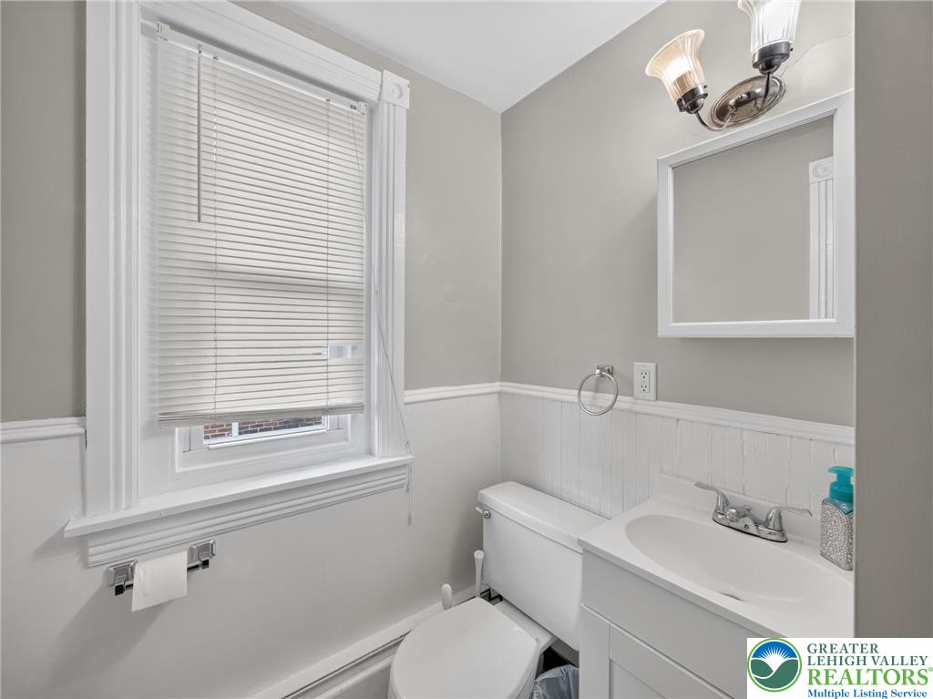 425 Ridge Street Emmaus, PA 18049 - Photo 23 of 27 A well-appointed bath with beadboard wainscoting and a crisp window providing natural illumination.