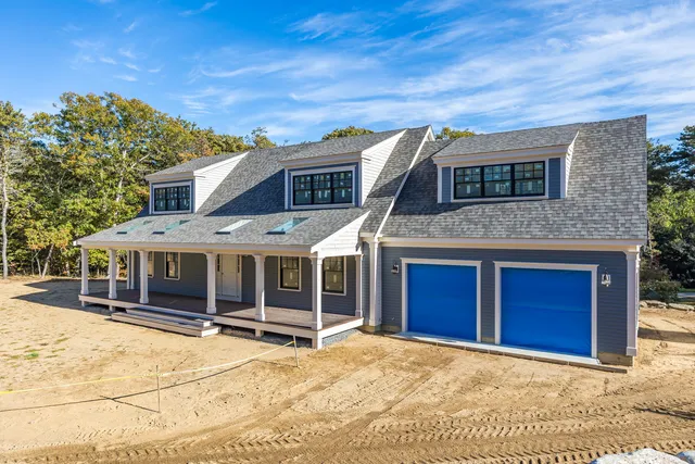 a view of a house with a backyard space and balcony