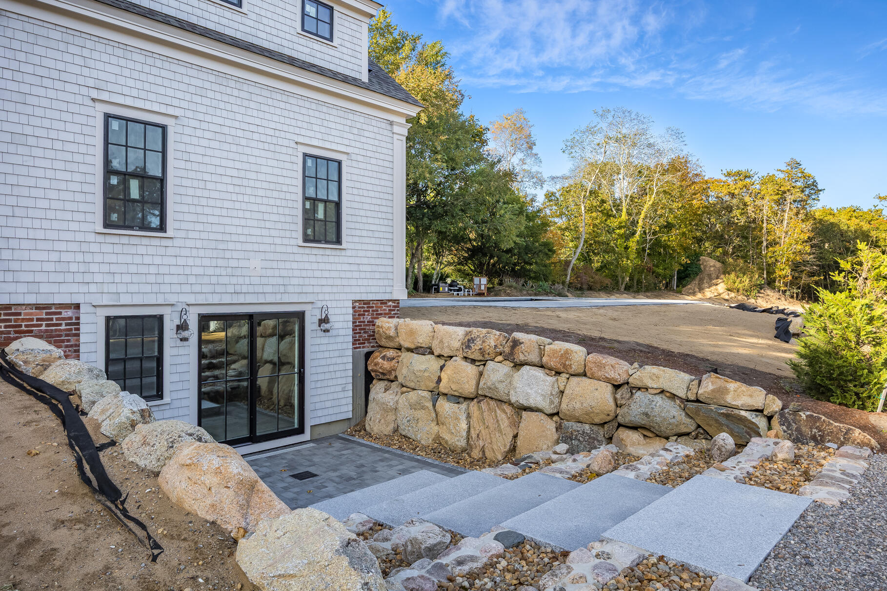 106-108 Chatham Road Harwich, MA 02645 - Photo 18 of 30 a view of a chairs and table in backyard of the house