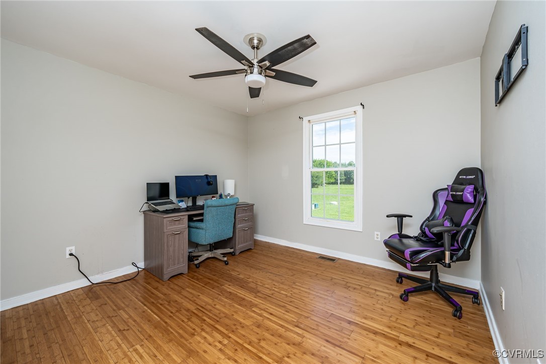 28312 Butler Branch Road Petersburg, VA 23805 - Photo 18 of 33 a workspace with wooden floor and a window
