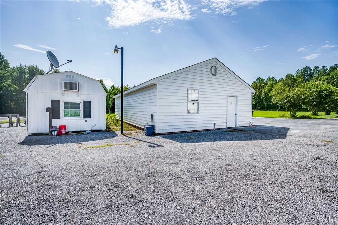 28312 Butler Branch Road Petersburg, VA 23805 - Photo 22 of 33 a view of a house with backyard and a garage