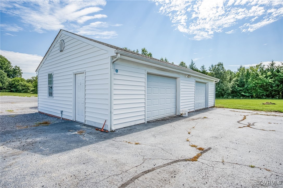 28312 Butler Branch Road Petersburg, VA 23805 - Photo 23 of 33 a view of a house with a backyard