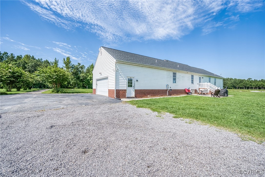 28312 Butler Branch Road Petersburg, VA 23805 - Photo 24 of 33 a view of a house with a big yard and large tree