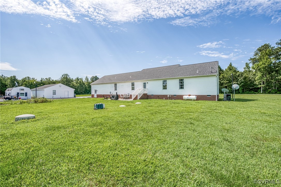 28312 Butler Branch Road Petersburg, VA 23805 - Photo 26 of 33 a view of a house with a big yard and palm trees