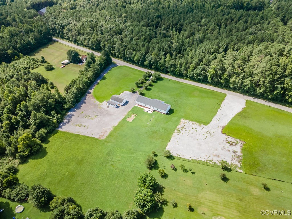 28312 Butler Branch Road Petersburg, VA 23805 - Photo 32 of 33 a view of a garden with a building in the background