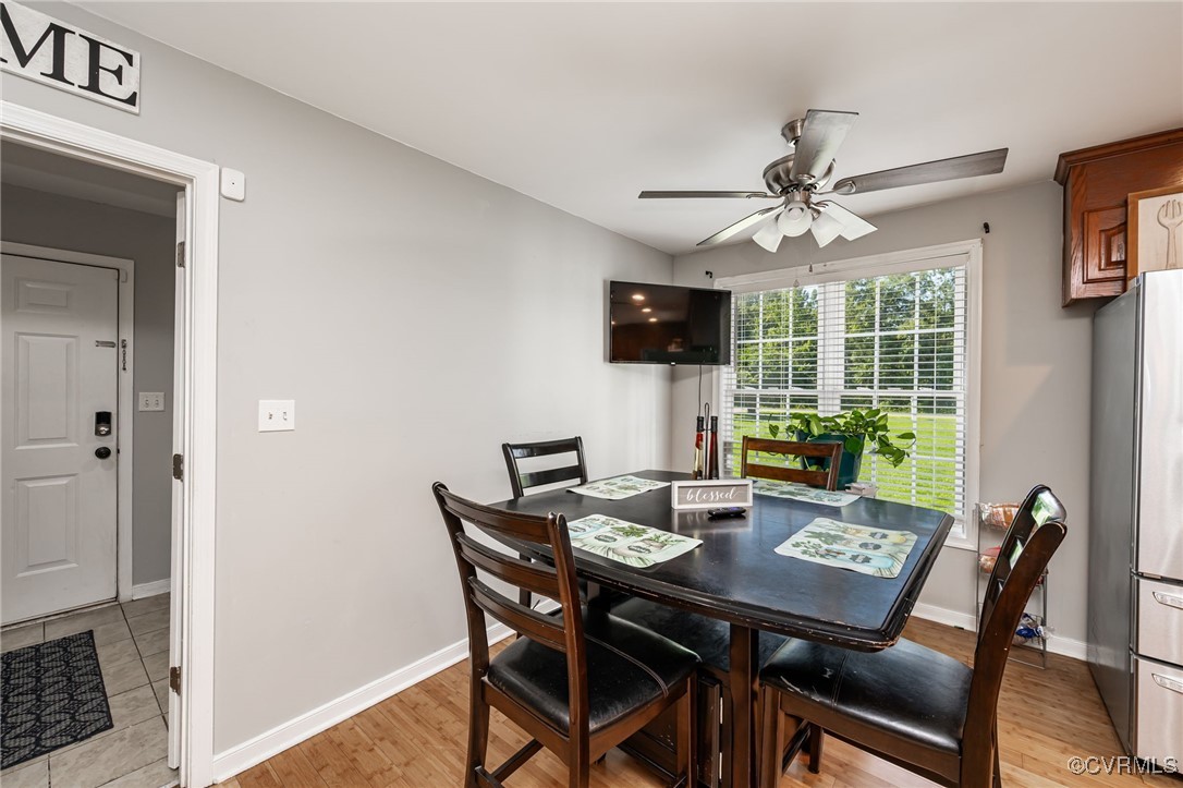 28312 Butler Branch Road Petersburg, VA 23805 - Photo 10 of 33 a view of a dining room with furniture window and wooden floor
