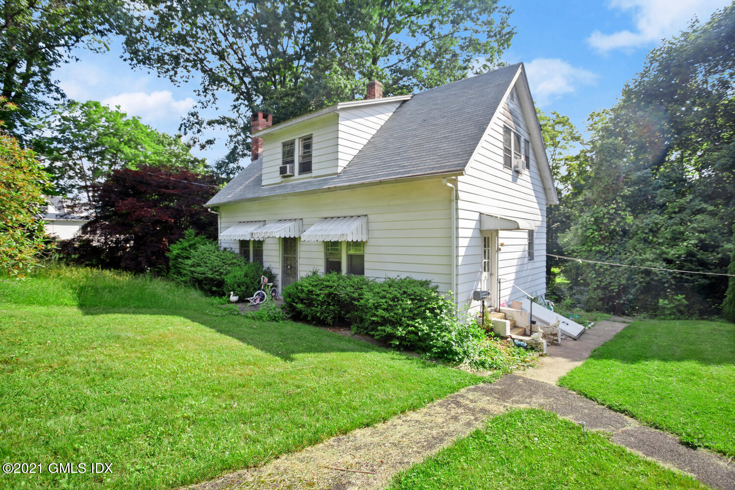 128 Halstead Avenue Greenwich, CT 06831 - Photo 5 of 11 a view of house with a yard