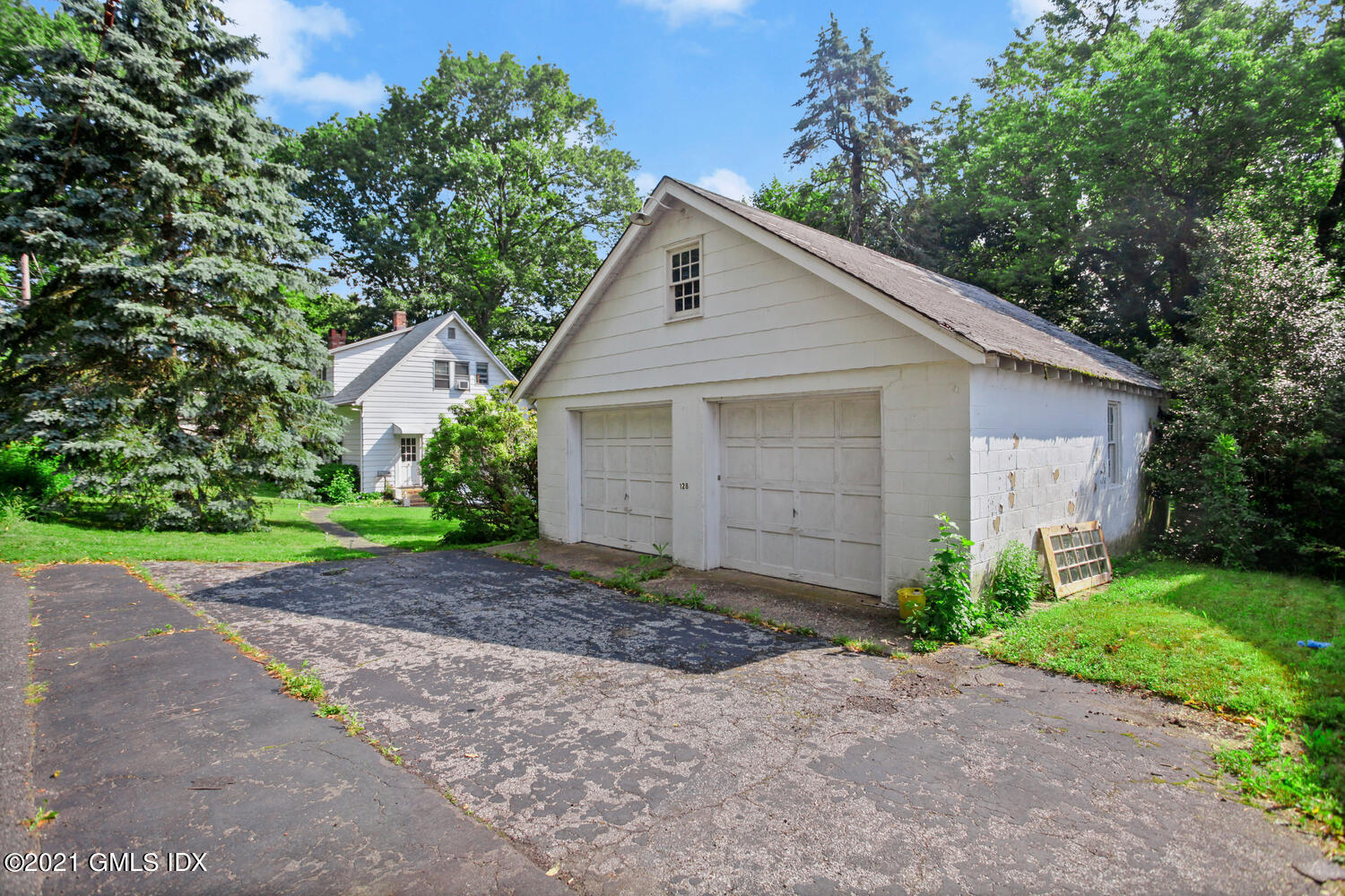 128 Halstead Avenue Greenwich, CT 06831 - Photo 8 of 11 a view of a house with a yard and large tree